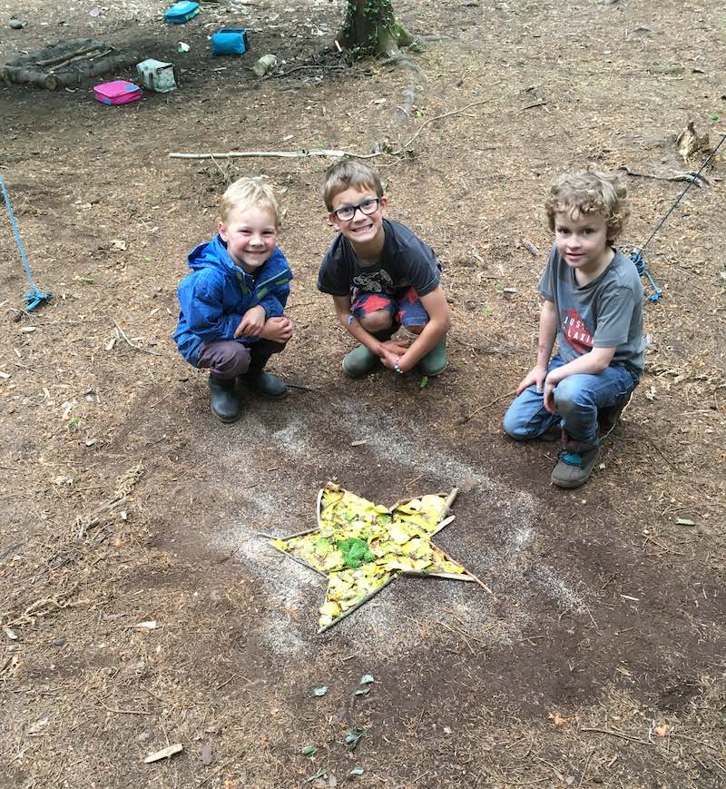 Boys smiling at Forest School Holiday Club
