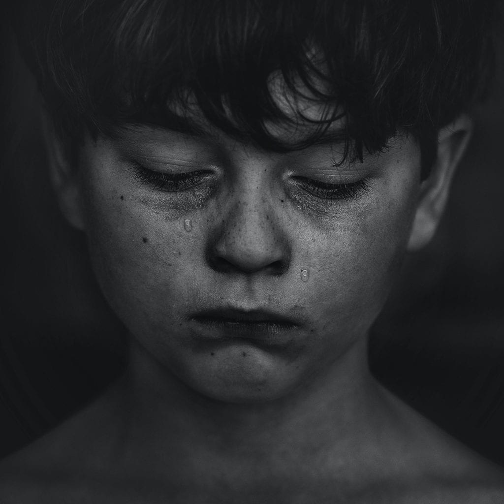 black-and-white-photo-of-boy-crying.